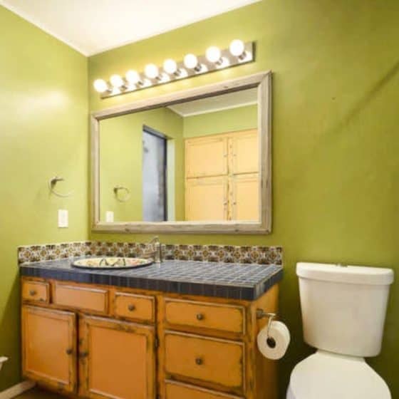 Bathroom Remodel With Vintage Blue Tile Countertop And Shower Walls