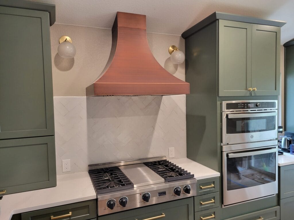 Range Hood, Lighting, Cabinets, Backsplash